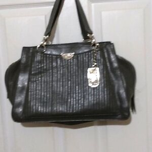 - Rosetti womans faux leather purse